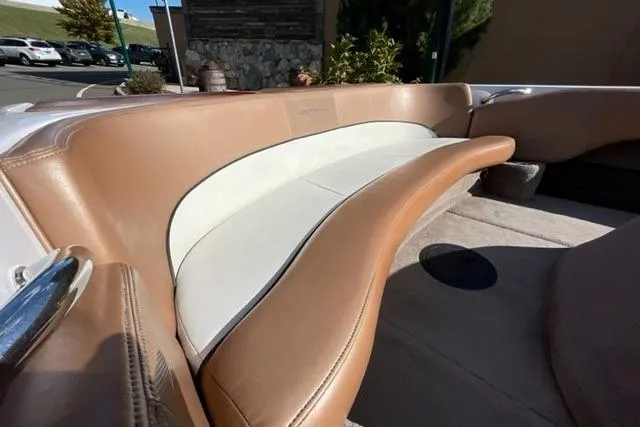 Slide: The Image of 2009 Nautique Ski Nautique 196 boat interior with tan and white seating. - 4