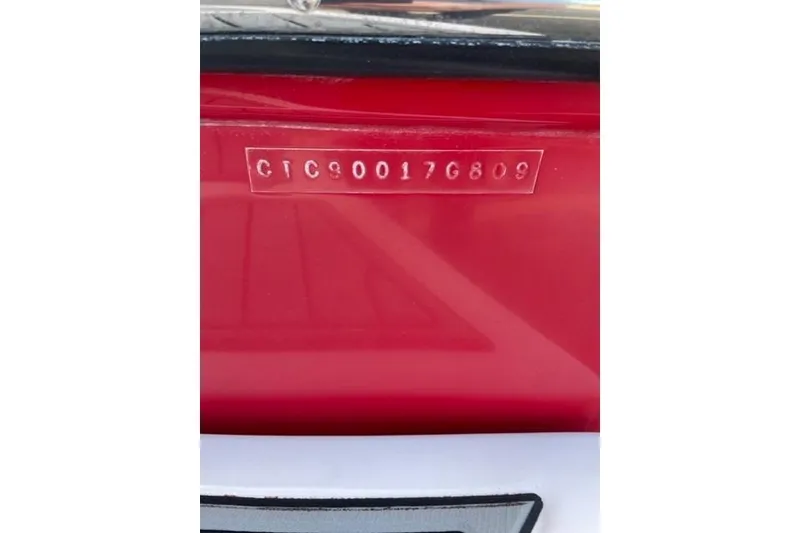 Slide: The Image of 2009 Nautique Ski Nautique 196 boat hull identification number on red surface. - 7