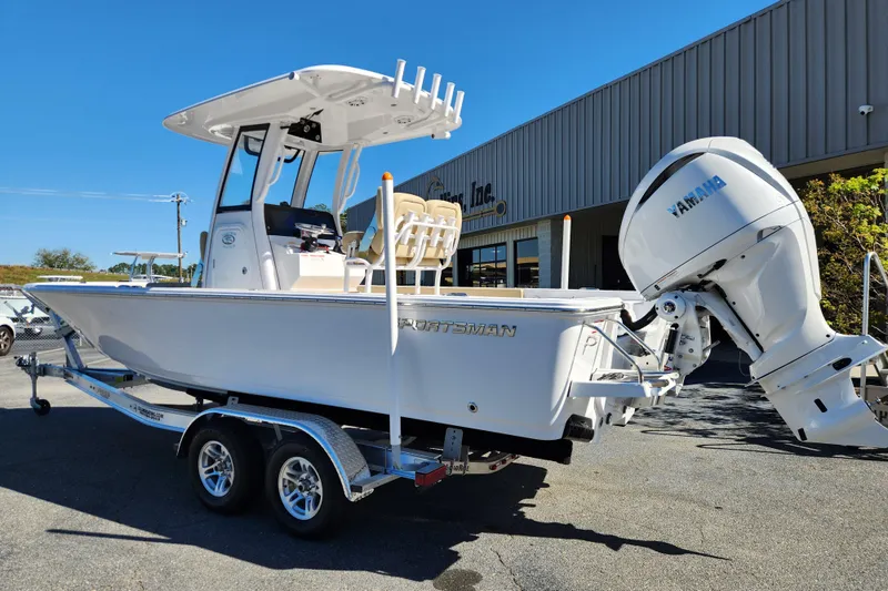 Slide: The Image of 2026 Sportsman Masters 247OE Bay Boat on trailer, featuring Yamaha outboard motor. - 2