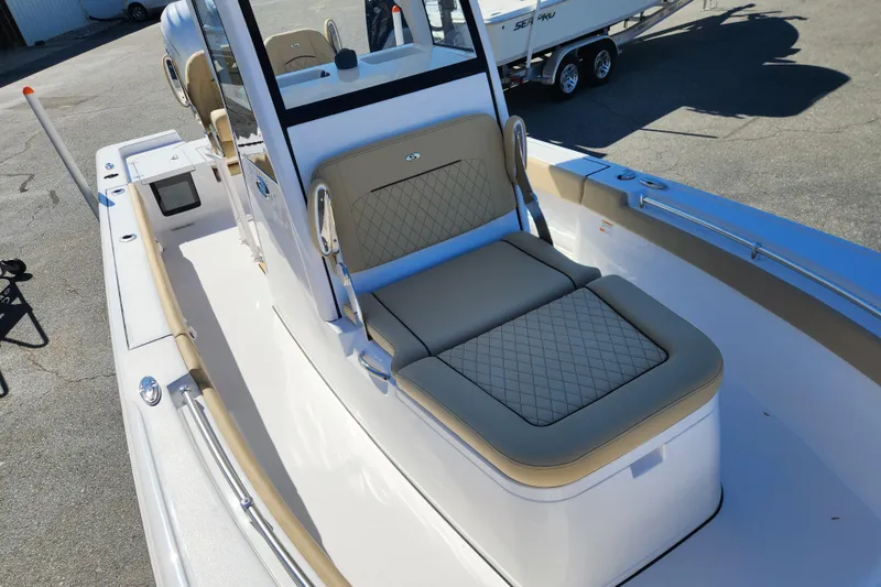 Slide: The Image of 2026 Sportsman Masters 247OE Bay Boat with cushioned seating and sleek design. - 8