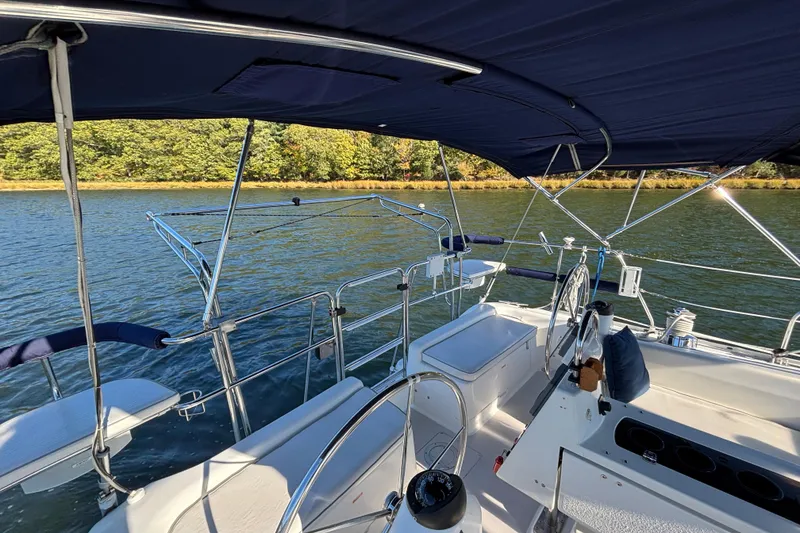 Slide: The Image of Cockpit view of 2004 Catalina 400 MkII sailboat on a serene lake. - 25