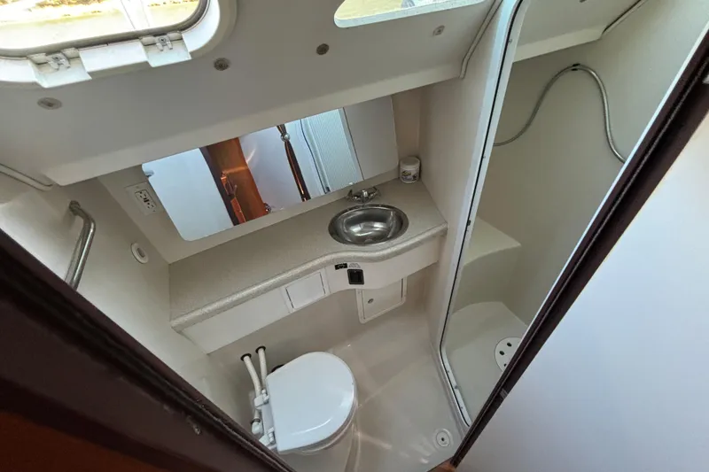 Slide: The Image of 2004 Catalina 400 MkII yacht bathroom with sink, toilet, and shower. - 4