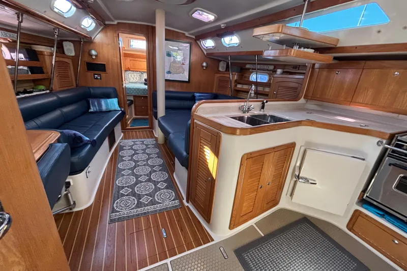 Slide: The Image of Luxurious 2004 Catalina 400 MkII yacht interior with wood finish and modern amenities. - 6