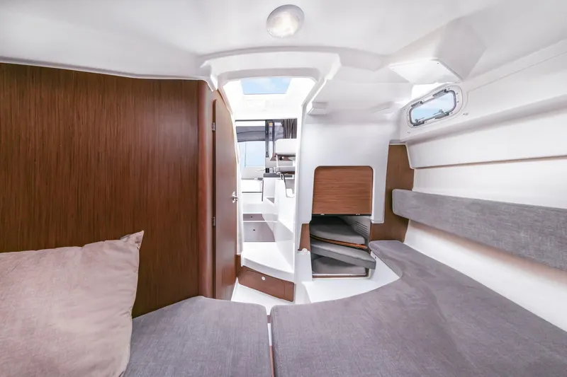 Slide: The Image of 2025 Beneteau Antares 8 interior cabin with modern design and comfortable seating. - 6
