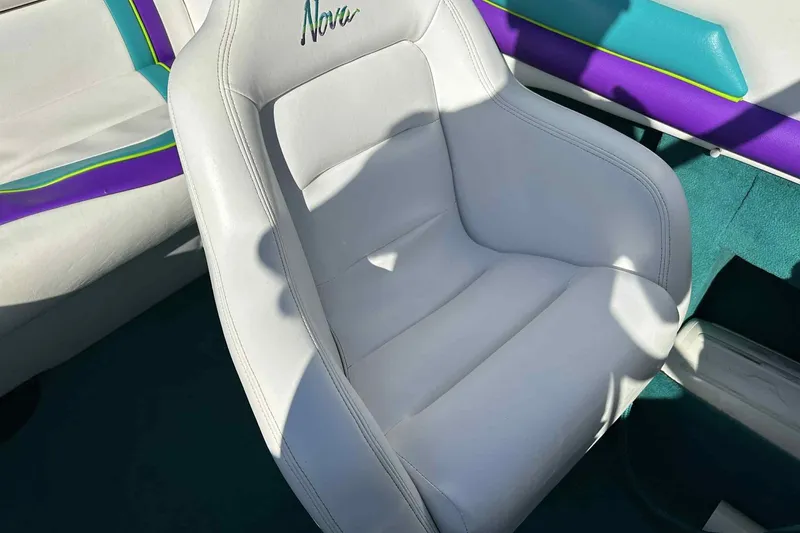Slide: The Image of White leather seat in 1993 Nova Spyder with colorful interior accents. - 3