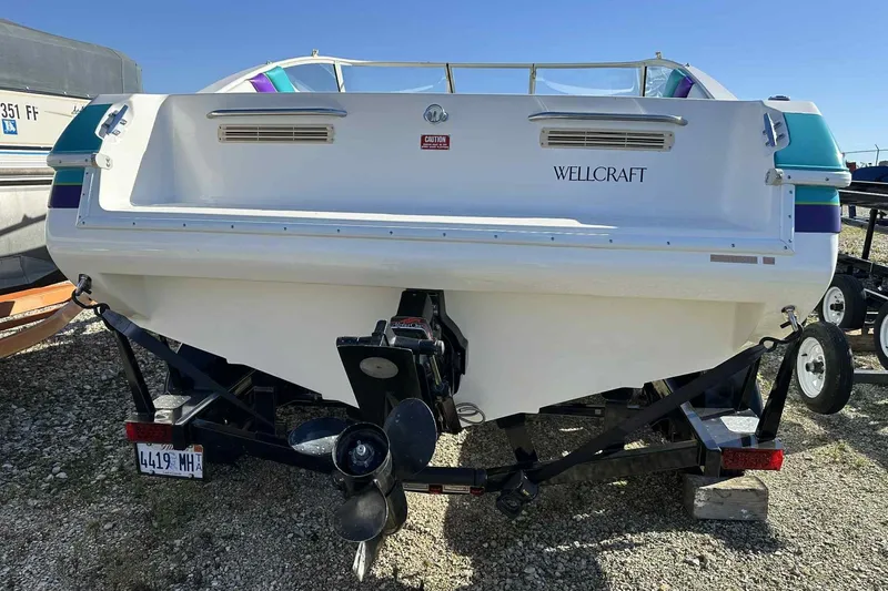 Slide: The Image of Rear view of a 1993 Nova Spyder Wellcraft boat on a trailer. - 4