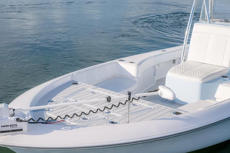 Slide: The Image of 2025 Contender 29 Bay boat with Minn Kota motor on calm water. - 13