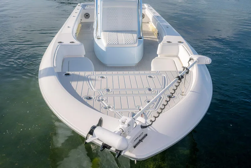 Slide: The Image of 2025 Contender 29 Bay boat on water, featuring spacious deck and modern design. - 14