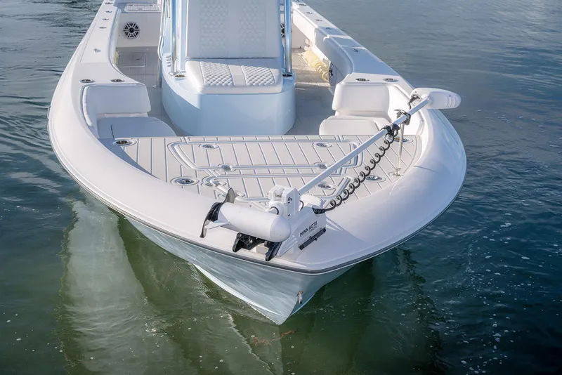 Slide: The Image of 2025 Contender 29 Bay boat on water, featuring sleek design and advanced trolling motor. - 15