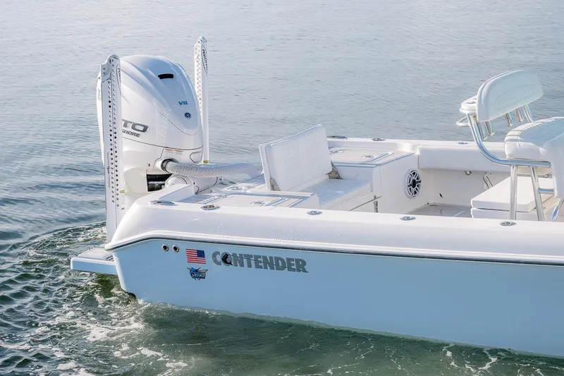Slide: The Image of 2025 Contender 29 Bay boat with V8 engine on calm water. - 16