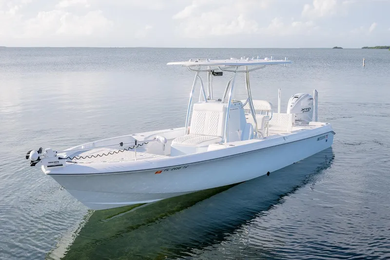 Slide: The Image of 2025 Contender 29 Bay boat on calm water, showcasing sleek design and modern features. - 5