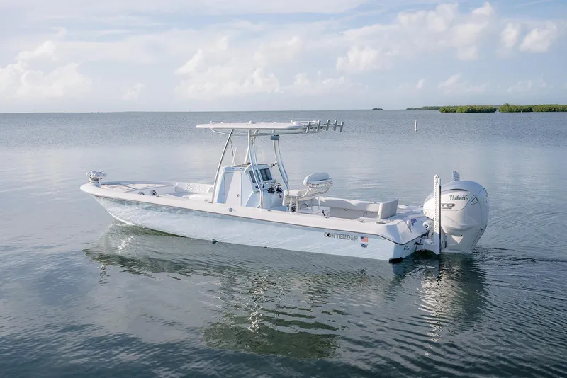 Slide: The Image of 2025 Contender 29 Bay boat on calm water, featuring sleek design and powerful engine. - 6