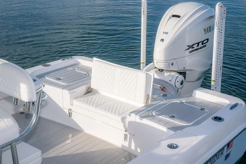 Slide: The Image of 2025 Contender 29 Bay boat with Yamaha XTO engine on calm water. - 9