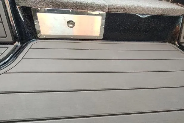 Slide: The Image of Interior of 2026 Phoenix 920 Elite X boat with sleek flooring and storage compartment. - 11