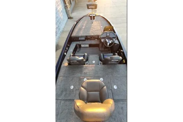 Slide: The Image of 2026 Phoenix 920 Elite X boat interior with seating and steering wheel. - 13
