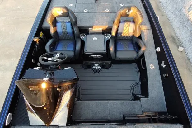 Slide: The Image of 2026 Phoenix 920 Elite X boat interior with dual seats and steering console. - 5