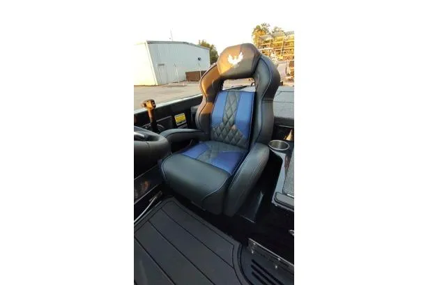 Slide: The Image of 2026 Phoenix 920 Elite X seat with blue and black leather, diamond stitching, and cup holder. - 9