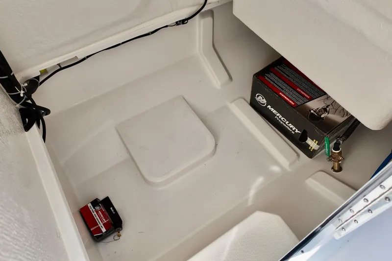 Slide: The Image of Storage compartment of 2026 Bayliner Trophy T22CC boat with Mercury engine box. - 14