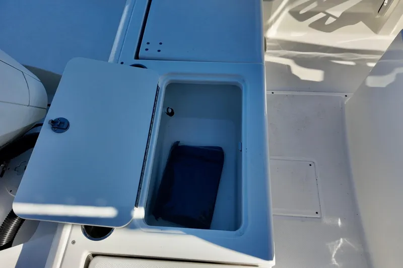 Slide: The Image of Open storage compartment on 2026 Bayliner Trophy T22CC boat deck. - 9