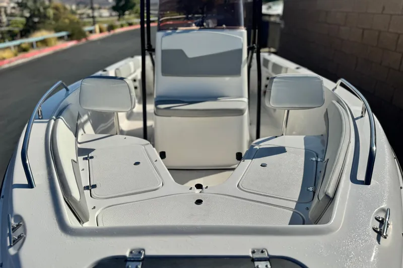 Slide: The Image of 2023 Key Largo 2001 CC boat interior with seating and storage compartments. - 11