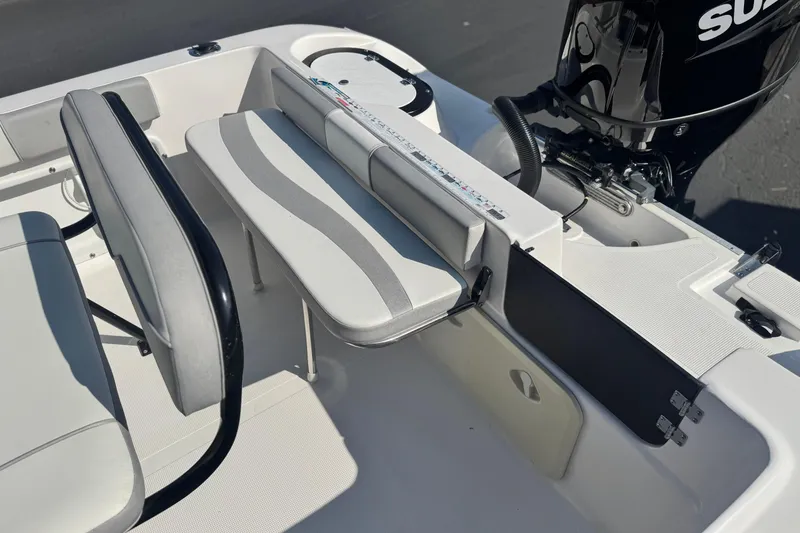 Slide: The Image of Key Largo 2001 CC boat interior with seating and motor, 2023 model. - 20