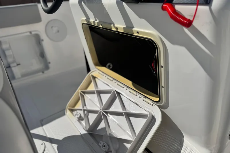 Slide: The Image of Open storage compartment on a 2023 Key Largo 2001 CC boat interior. - 26