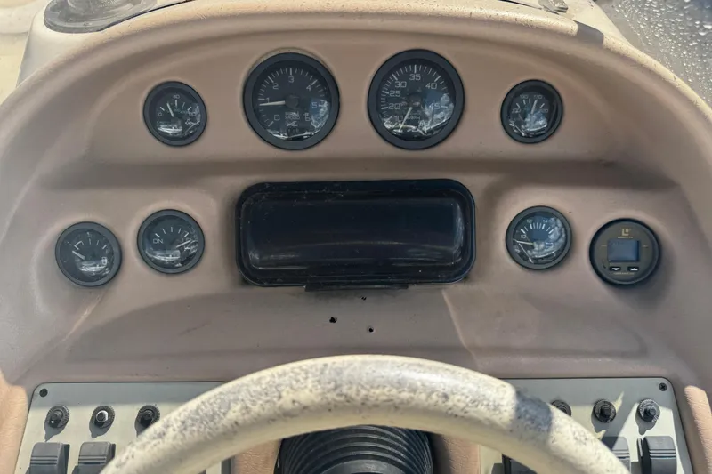 Slide: The Image of 1996 Sea Ray 240 Sundeck boat sink with faucet and cup holder. - 11