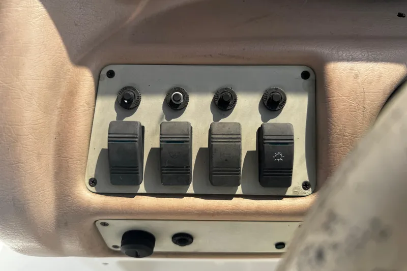 Slide: The Image of Compass on 1996 Sea Ray 240 Sundeck boat dashboard, featuring Ritchie brand. - 12