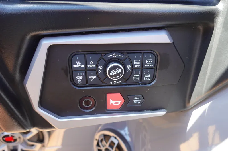 Slide: The Image of Control panel of 2022 Axis T23 boat with various function buttons and start/stop switch. - 11