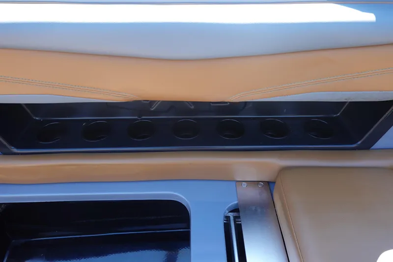 Slide: The Image of 2022 Axis T23 interior with tan leather seating and integrated cup holders. - 21