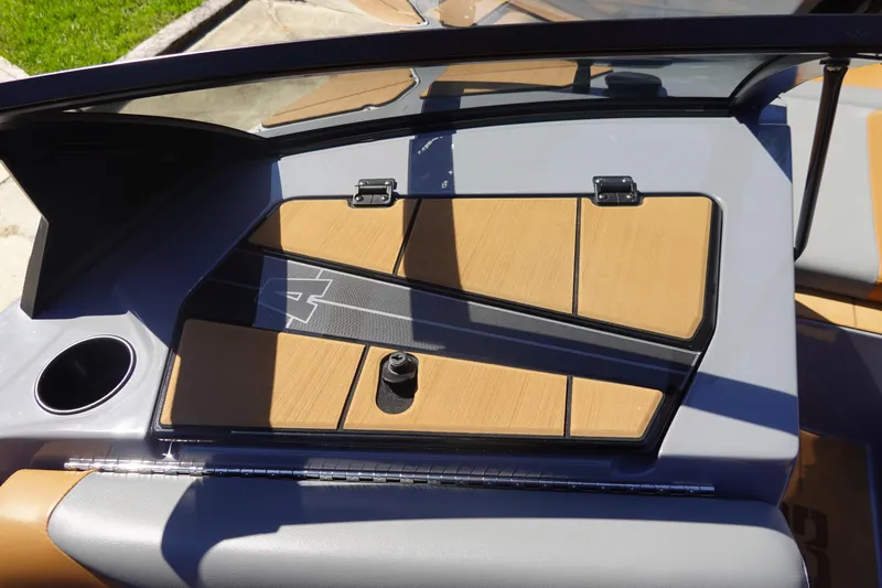 Slide: The Image of 2022 Axis T23 boat interior with sleek dashboard and cup holder. - 25