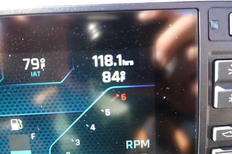 Slide: The Image of Dashboard display of 2022 Axis T23 showing temperature and engine hours. - 27