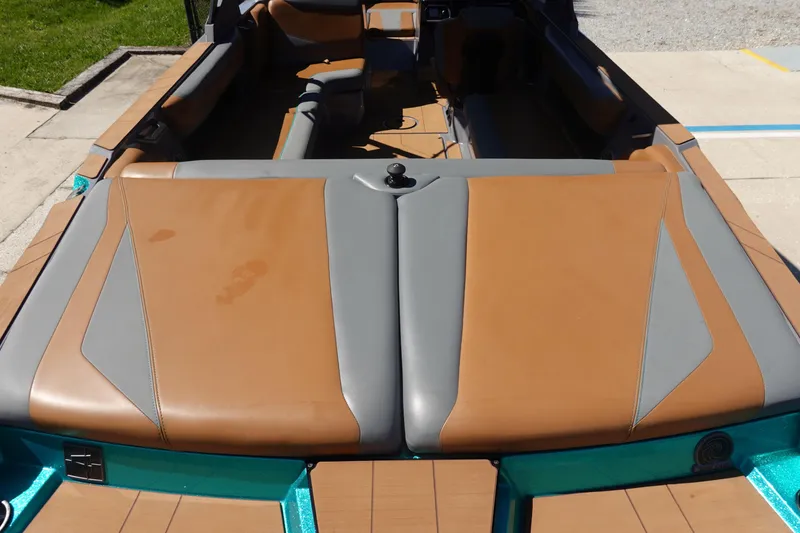 Slide: The Image of 2022 Axis T23 boat interior with tan and gray upholstery, viewed from above. - 6