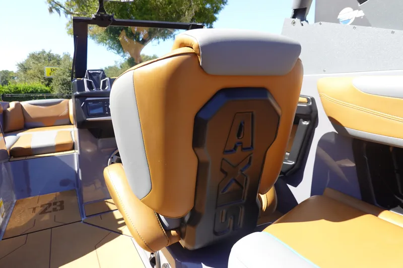 Slide: The Image of 2022 Axis T23 boat interior with tan and gray seating, showcasing modern design. - 8
