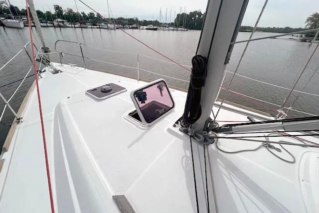 Slide: The Image of Sailing yacht Beneteau Oceanis 37, 2013 model, deck view with open hatch. - 2