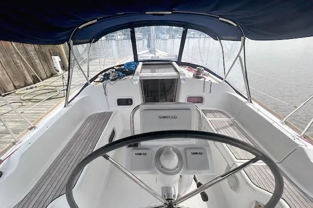 Slide: The Image of Cockpit view of 2013 Beneteau Oceanis 37 sailboat with steering wheel and navigation equipment. - 3