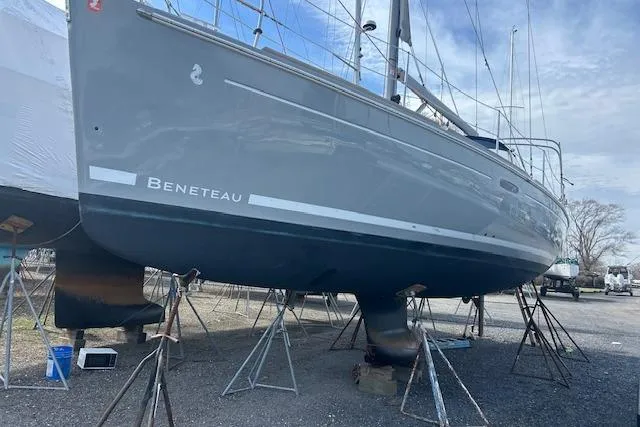 Slide: The Image of 2013 Beneteau Oceanis 37 sailboat on stands, displayed outdoors. - 6