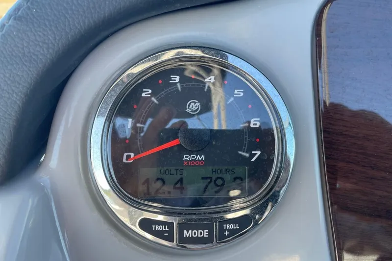 Slide: The Image of Close-up of 2022 Chaparral 23 SSi tachometer displaying RPM and voltage. - 11