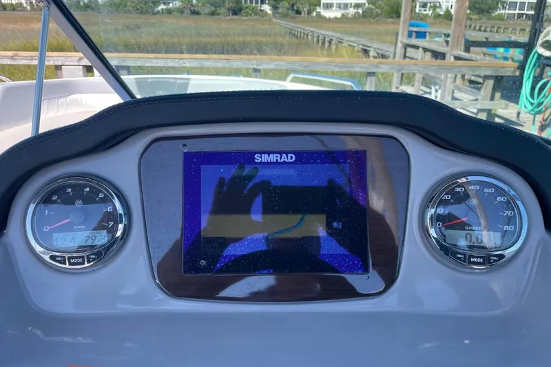 Slide: The Image of Dashboard of 2022 Chaparral 23 SSi boat with Simrad display and gauges. - 12