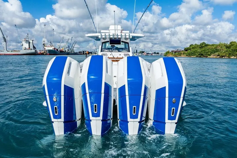 Slide: The Image of 2025 HCB 53 Suenos RXV with four powerful outboard engines on the water. - 12