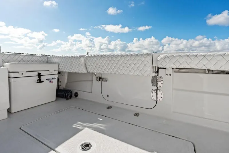 Slide: The Image of 2025 HCB 53 Suenos RXV boat deck with quilted seating and storage. - 15