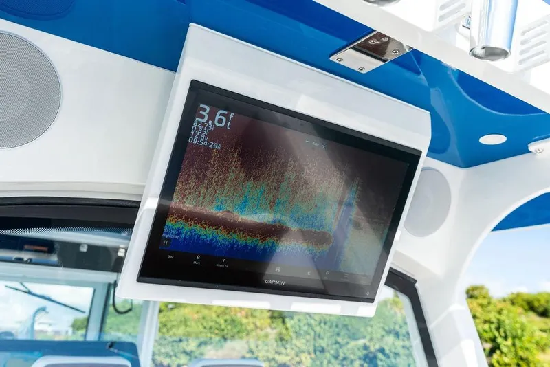 Slide: The Image of 2025 HCB 53 Suenos RXV boat with Garmin fishfinder display. - 18
