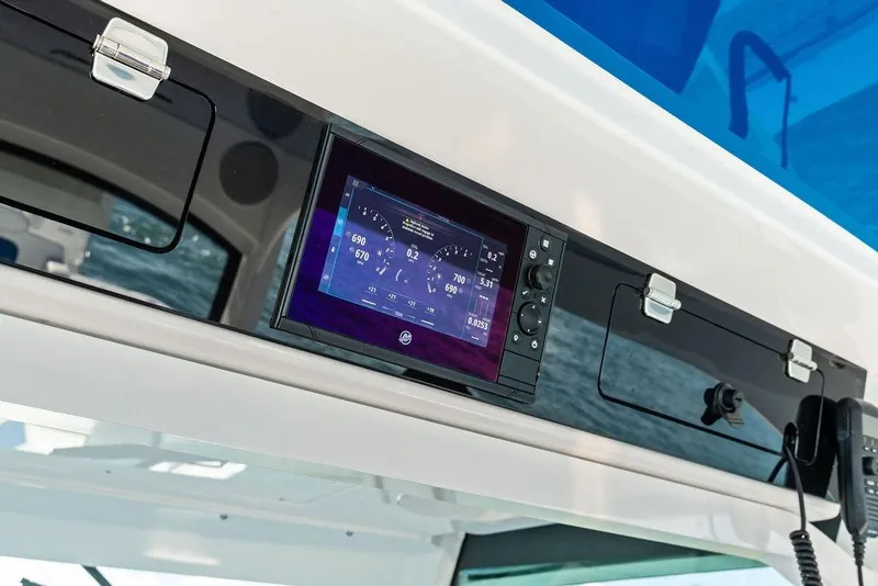 Slide: The Image of 2025 HCB 53 Suenos RXV dashboard with digital display and controls. - 27