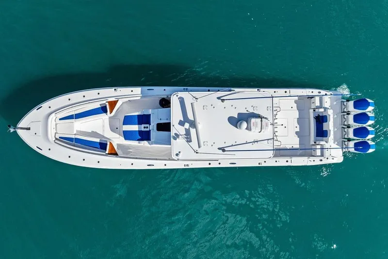 Slide: The Image of Aerial view of 2025 HCB 53 Suenos RXV boat on turquoise water. - 7