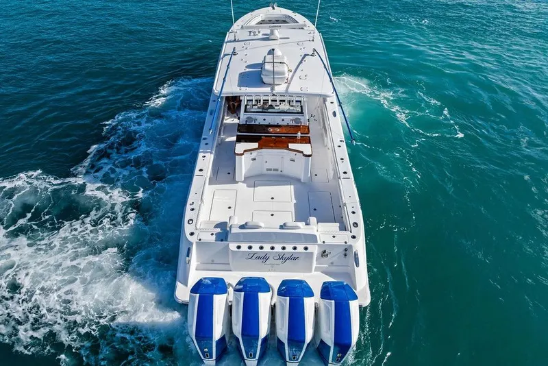 Slide: The Image of 2025 HCB 53 Suenos RXV luxury boat cruising on open water. - 9