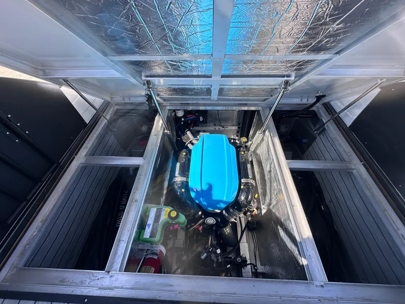 Slide: The Image of Interior of 2026 Montara Surf Boss 2.0 SL 23" boat, featuring modern helm and seating. - 14