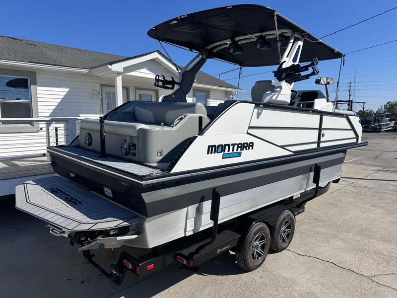 Slide: The Image of Luxurious interior of 2026 Montara Surf Boss 2.0 SL 23" boat with plush seating. - 17