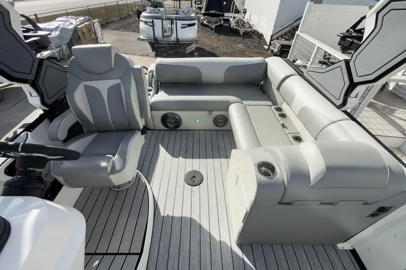Slide: The Image of 2026 Montara Surf Boss 2.0 SL 23" boat interior with gray seating and cup holders. - 18