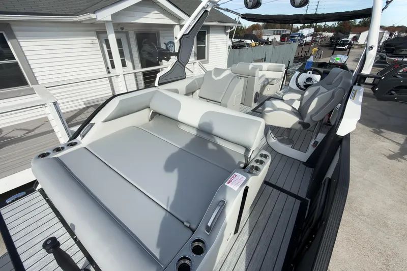 Slide: The Image of 2026 Montara Surf Boss 2.0 SL 23" boat interior with seating and cup holders. - 21