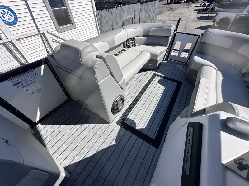 Slide: The Image of 2026 Montara Surf Boss 2.0 SL 23" boat on trailer, parked outside a building. - 3